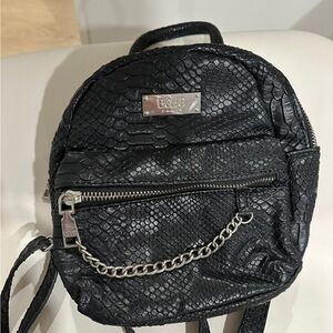 BCBG faux snakeskin mini back pack with chain detail